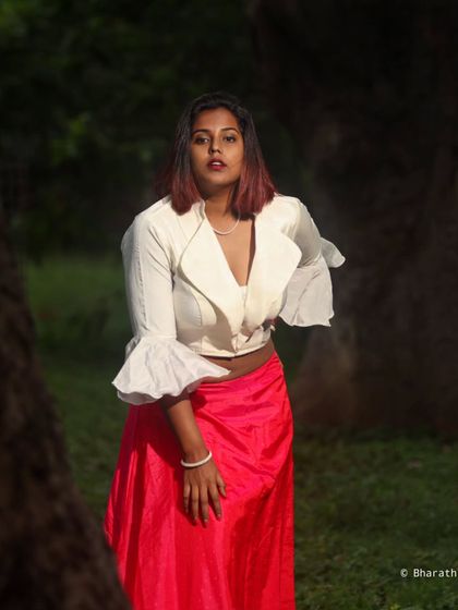 This outdoor portrait uses the natural light filtering through the trees to create a soft and flattering effect.