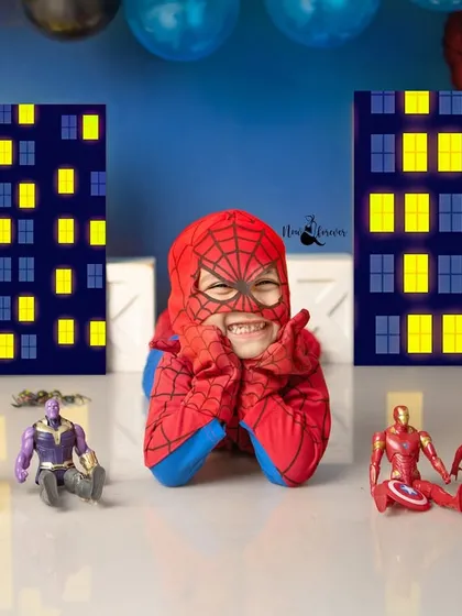 With a super smile, this little Spider-Man is ready to save the day. The cityscape background and his fellow Avengers make for an action-packed scene.