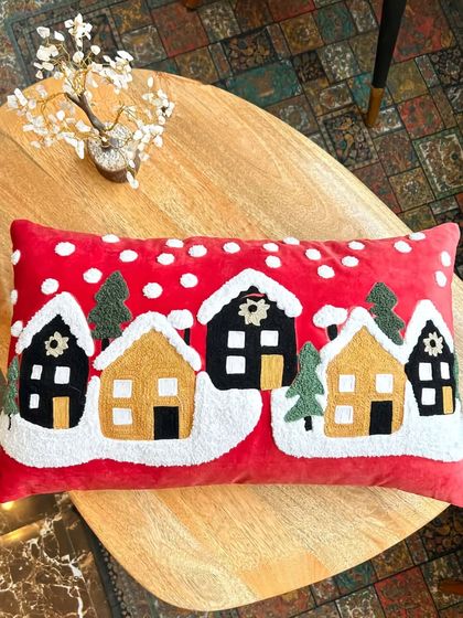 Jingle bell rock your home decor with our fun and festive Christmas cushion covers. This design features a snowy village scene, made with soft, high-quality materials.