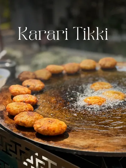 Here you can see the Karari Tikkis getting that perfect crispy texture on the large tawa. This live cooking method ensures every serving is hot, fresh, and delicious.