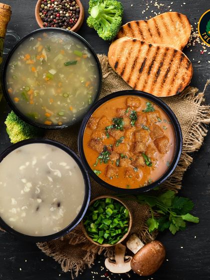 A spread of my healthy soups and meals. Each bowl is designed to nourish your body and soul, offering comfort without compromising on your health goals.