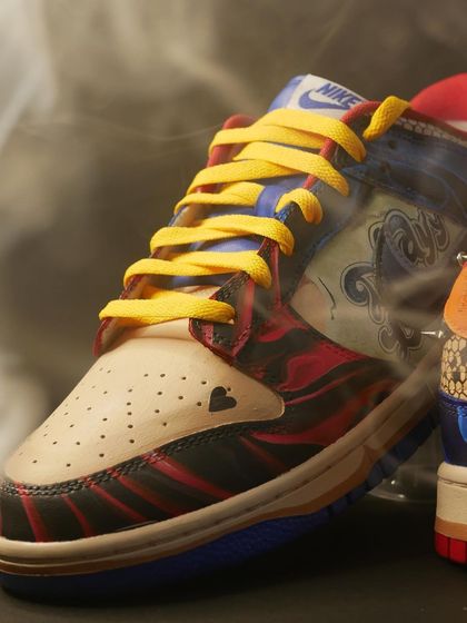 A smoky close-up of the front of the Harley Quinn custom. The little heart on the toe box is a nod to her classic design.