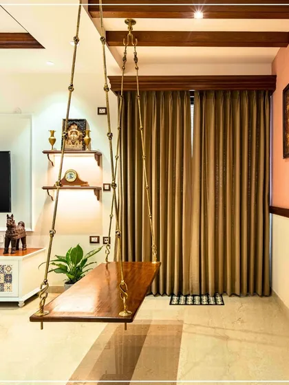 A different angle of the swing, showing its placement within the living area and its connection to the overall traditional theme.
