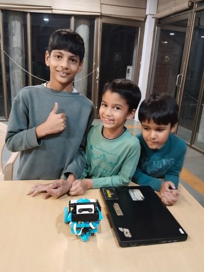 A team of young innovators ready to test their creation. My small group classes ensure every child gets personalized attention while learning to collaborate effectively.