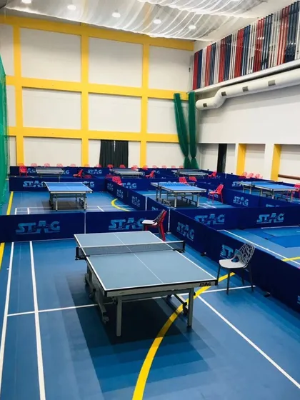 Ready for some fast-paced action. A clear view of our professional table tennis arena, featuring 8 Stag Americas tables, multi-sport flooring, and an air circulation system for optimal playing conditions.