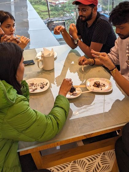 Enjoying some delicious local desserts at a cafe in Kodaikanal, a sweet end to the day.