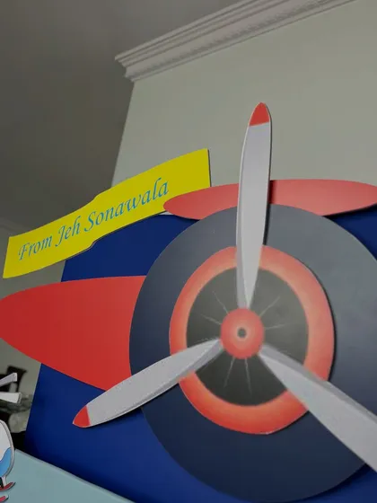 A detailed shot of the large propeller and the 'From Jeh Sonawala' gift tag, showing the high-quality cutouts and personalization that define my themed hampers for kids.