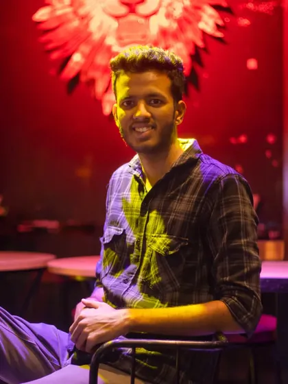 Taking a quick break during a lounge photoshoot, with the ambient lighting creating a cool mood.