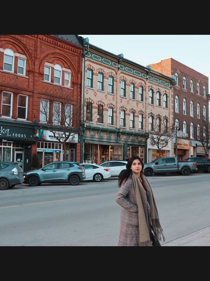 A street style shot in Stratford, with the historic downtown buildings providing a charming backdrop.