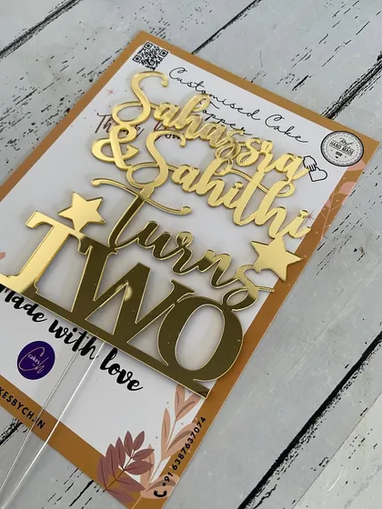 A special topper for twins! This design for "Sahassra & Sahithi Turns TWO" combines both names into one beautiful piece.