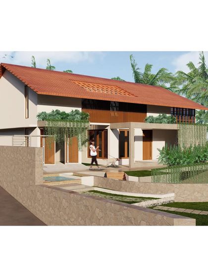 This residence in Mangalore features a traditional sloping tiled roof and a design that works with the site's natural contours. The stepped garden and water feature in the foreground help to manage the terrain while adding aesthetic appeal.