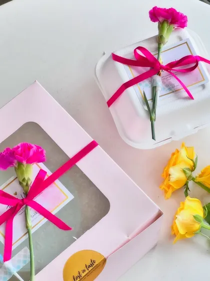 Various examples of my gift wrapping, showing different combinations of ribbons, flowers, and bags to suit any occasion.