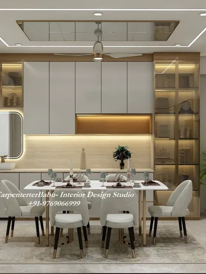 The dining area is where families come together. I designed this space to be both elegant and practical, with a sleek dining table and comfortable chairs. The custom cabinetry provides ample storage and display space, while the warm, ambient lighting from the false ceiling creates a perfect atmosphere for shared meals and conversations.