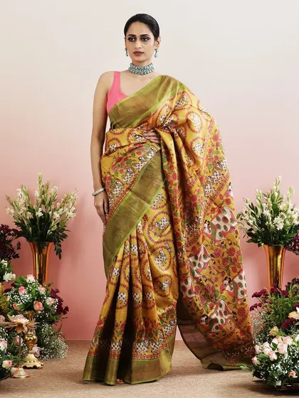 The full view of the mustard yellow Pichwai saree, a vibrant and artistic masterpiece.