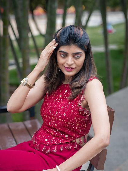 A relaxed outdoor portrait on a park bench. This candid style is great for capturing a natural and approachable look.