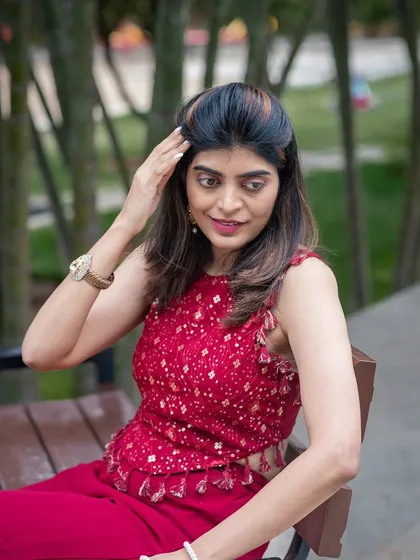 A relaxed outdoor portrait on a park bench. This candid style is great for capturing a natural and approachable look.