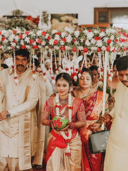 The bride's grand entrance under a canopy of flowers, a breathtaking moment at any wedding.