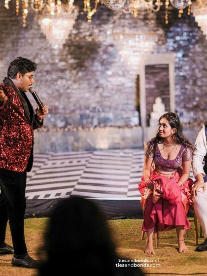 Playing the shoe game with a couple at their Sangeet. The bride's expression says it all. It's a game full of laughter and surprises.