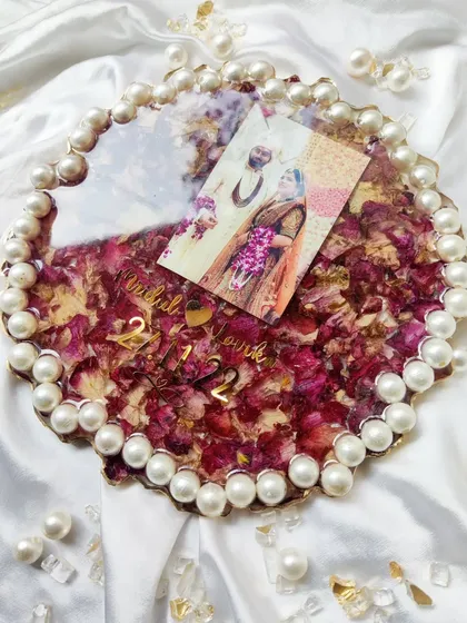 These images and videos showcase various angles and the creation process of my custom wedding and anniversary varmala preservation frames. Each one is made with love to turn your special memories into a timeless treasure.