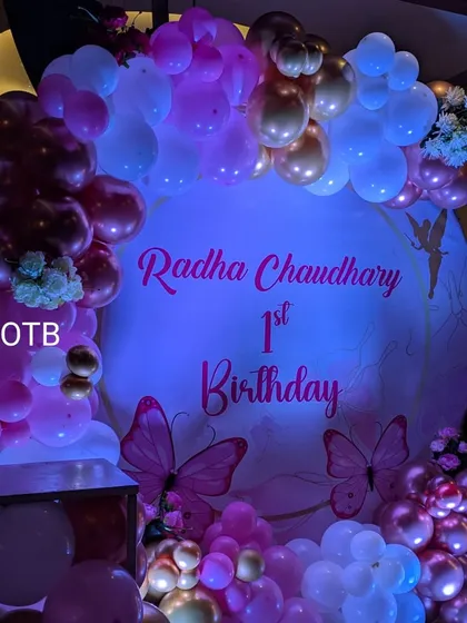 The pink and purple lighting really enhances the butterfly theme, creating a dreamy and enchanting atmosphere for the party.