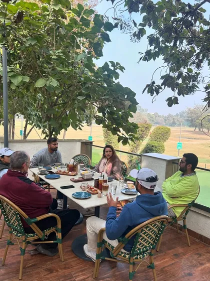 A productive morning meeting at the cafe, combining business with the pleasure of a great view.