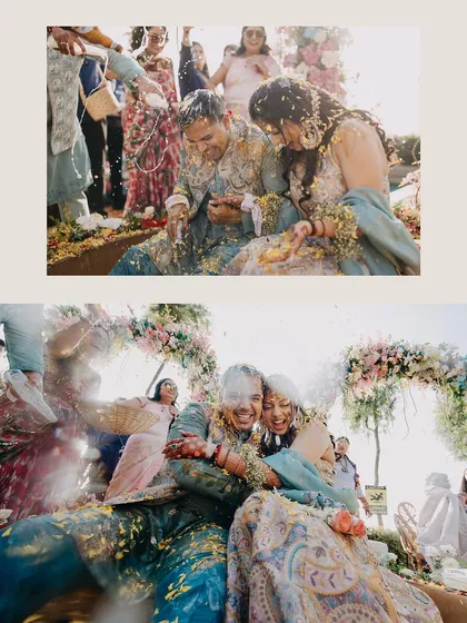 The messy, joyful aftermath of the Haldi ritual. This image captures the raw, uninhibited fun as the couple is covered in turmeric and flower petals.