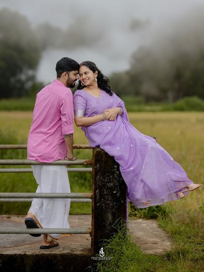 An intimate pose on the bridge, leaning in close. The misty background adds a layer of romance and mystery.