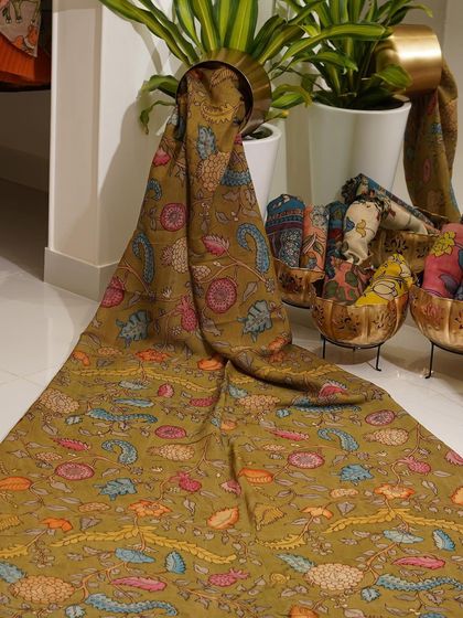 This is a glimpse into my Kalamkari Edition, featuring a wide array of hand-painted dupattas and fabrics from the Indralokam series. Each piece is a unique story, available for you to customize into your dream outfit.
