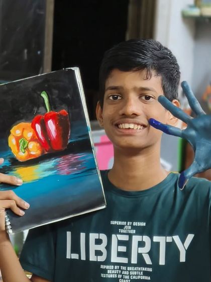 Practice makes perfect, and sometimes a little messy. Sahil shows off his finished capsicum painting, a result of dedicated practice sessions where students explore color and form.