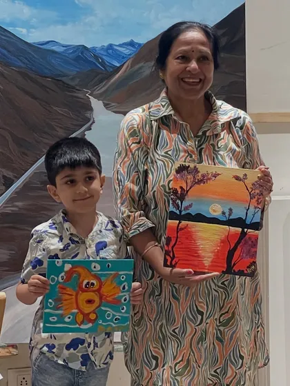 Art is for everyone, at any age. It's so heartwarming to see different generations creating side by side, like this grandmother and grandson enjoying a painting session together.