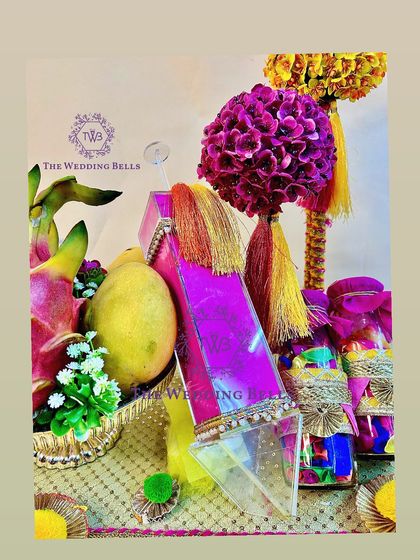 A close-up of the iridescent acrylic pichkari, a standout element in our luxury Holi hamper.