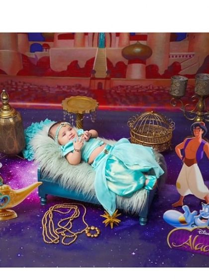 A whole new world. This magical Aladdin-themed newborn shoot features our custom Jasmine outfit, perfect for creating unforgettable first memories.