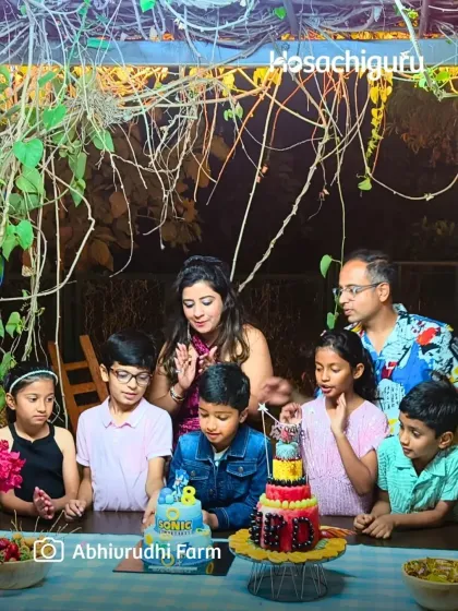 A family gathers around a birthday cake at Abhivrudhi Farm. These celebrations are a reminder that the farm is not just an investment, but a place for joy and togetherness.