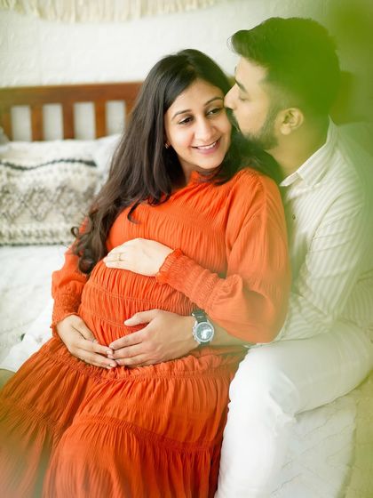 The same tender moment as image 88, but in a warm, vibrant color that highlights the joy of the session.