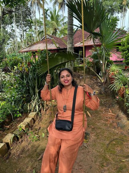 A trekker enjoying the swing at our Wayanad homestay.