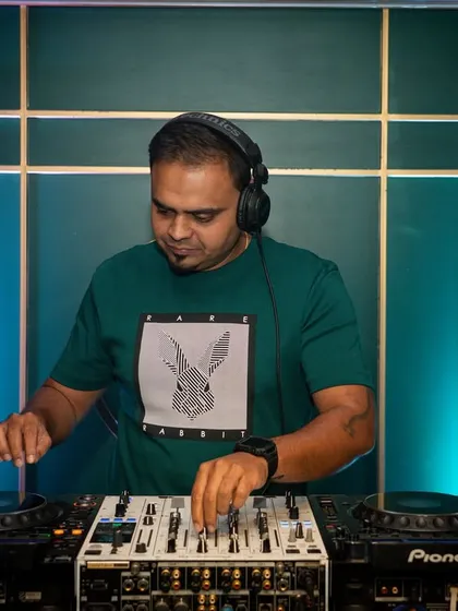 A focused shot of me at the decks, getting ready for a special Holi-themed night.