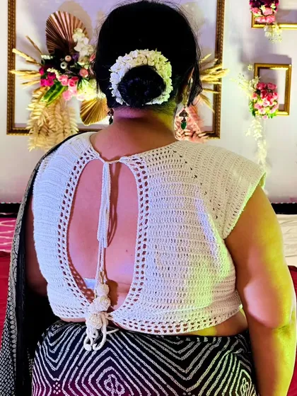 I love creating pieces that blend traditional style with a modern, handmade touch. This backless crochet blouse is a perfect example, designed to be a standout piece that is both elegant and unique for any special occasion.