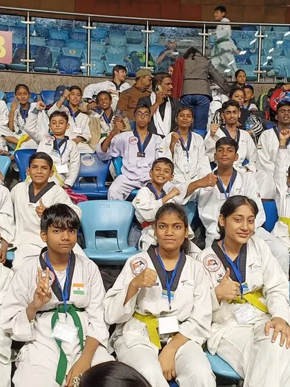 The team showing their spirit from the audience at the national championship.