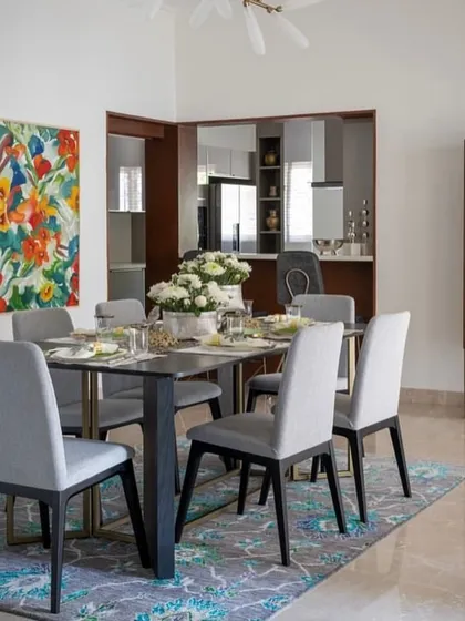 A dining room designed by Aurora Studio, featuring our custom dining table and chairs. The simple, elegant lines of the furniture create a sophisticated space for family meals.