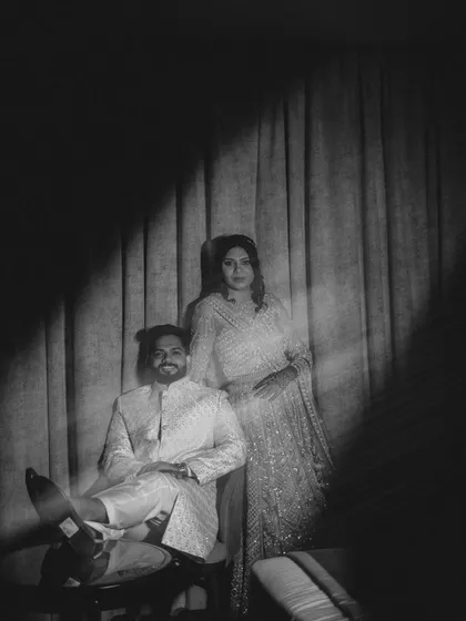 A moody, vintage-style black and white portrait. The creative use of shadow and motion blur gives this image a timeless, artistic, and dramatic feel.