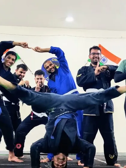 Training while having fun, that's our motto. A group of our students posing after a tough but rewarding Gi Jiu-Jitsu session.