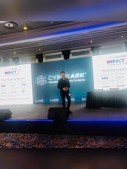 A wide shot of me on stage at a CyberArk event. Performing for large audiences requires a certain energy to connect with everyone in the room.