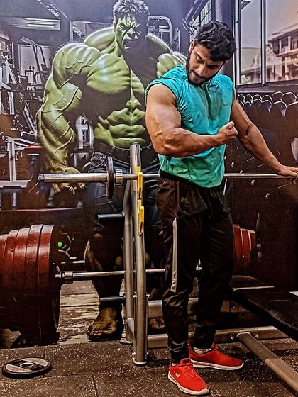 Time changes, but I will change time. Posing next to the Hulk mural, a little motivation to keep pushing for superhuman results.