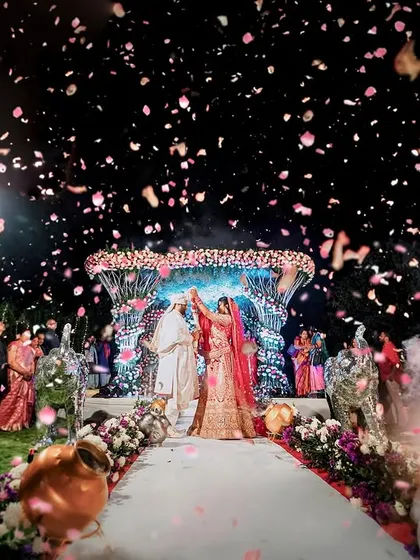 A fairytale jaimala moment under a sky of fireworks and a shower of petals. We coordinate every element, from the floral mandap to the pyrotechnics, to make your union truly spectacular.