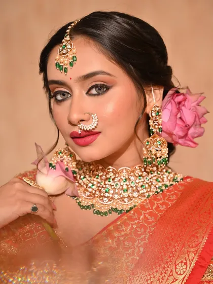 Another beautiful shot of the lotus flower look, with the model holding a lotus bud.