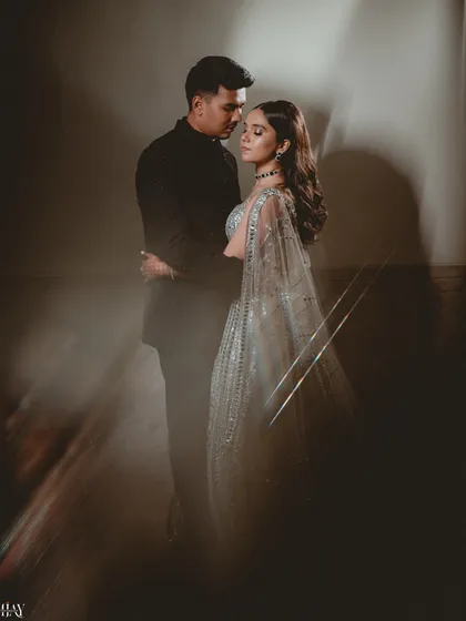 A romantic and artistic portrait of the couple, with light streaks creating a magical and ethereal feel.