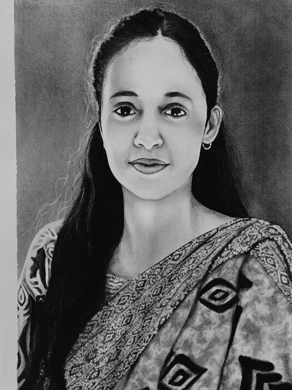 A commissioned graphite pencil sketch on A4 paper. I paid close attention to her gentle expression and the delicate details of her saree to create a portrait her family will treasure.