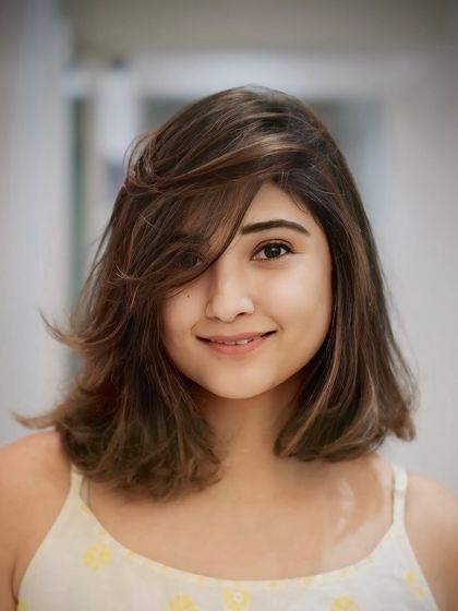 Bold, edgy, and bobbed. This medium-length cut features soft layers and a feathered fringe for a relaxed yet stylish vibe.