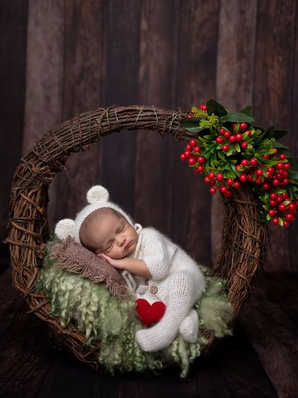 The same setup as before, but the addition of a small red heart prop adds a touch of warmth and love to the image.