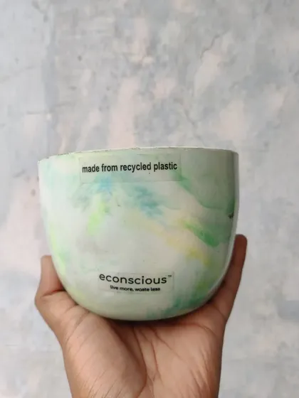 A soft, mint-green marble pattern gives this recycled planter a calm and gentle feel. It's a testament to how waste can be reborn as an elegant and functional piece of decor.